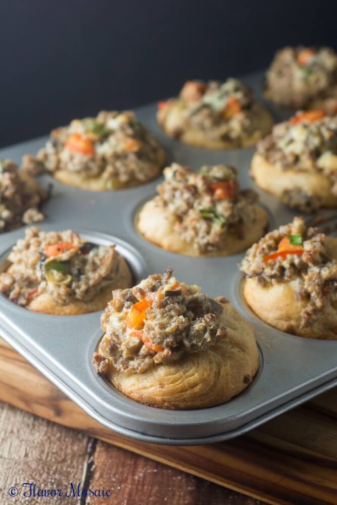 These Sausage Mediterranean Cups, with sausage, feta cheese, olives, and tomatoes, make tasty appetizers for Thanksgiving or Holiday party.
