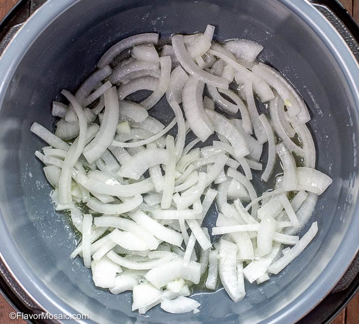 Overhead photo of sliced onions in Instant Pot