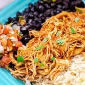 Instant Pot Chicken Tinga with rice and beans on blue plate