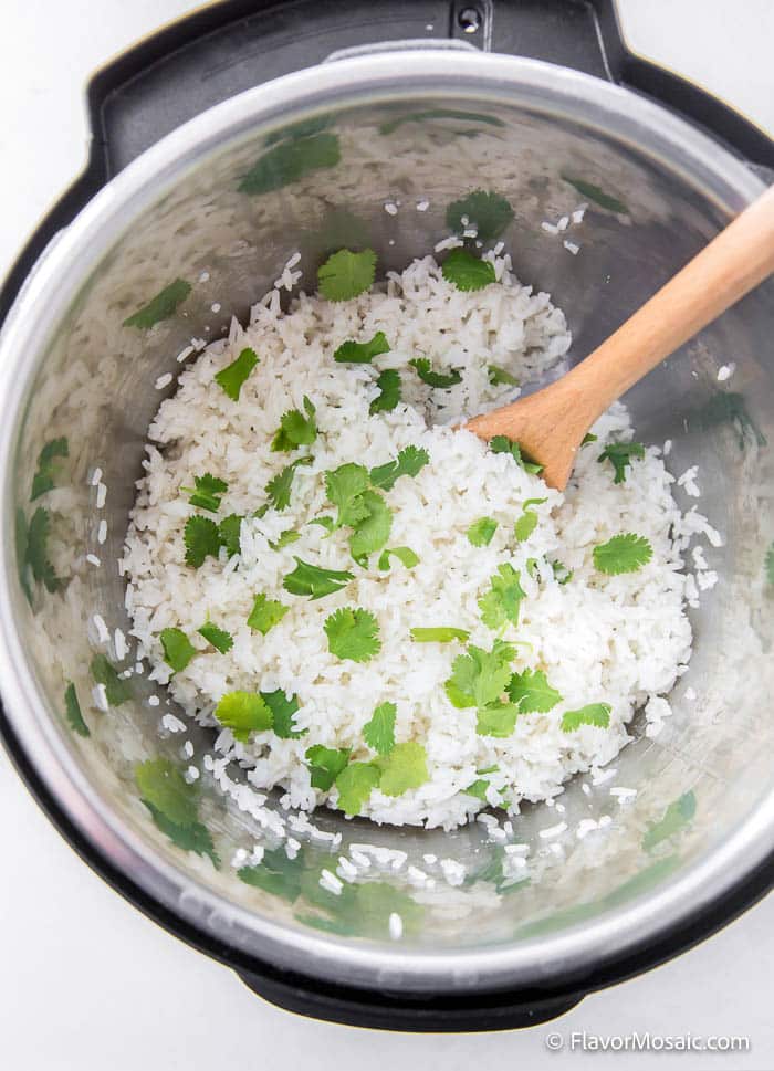 Overhead view of Instant Pot Cilantro Lime Rice in the Instant Pot pressure cooker after it has finished cooking.