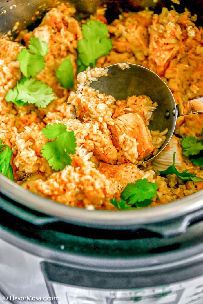 Overhead view of Chicken and Rice topped with chopped cilantro inside an instant pot.