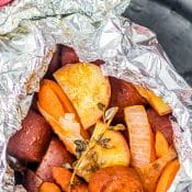 Hobo Dinner Foil Packet on cast iron platter that is perfect for your camping meal.