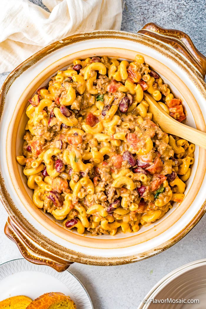 Overhead view of a large serving bowl with easy, cheesy Instant Pot Chili Mac.