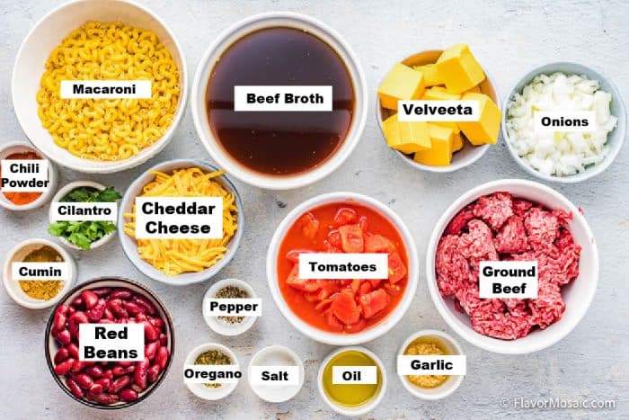 Overhead view of labeled ingredients in separate bowls used to make Instant Pot Chili Mac recipe.