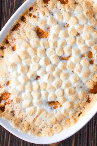 Overhead view of sweet potato casserole with marshmallows just after being removed from the oven.