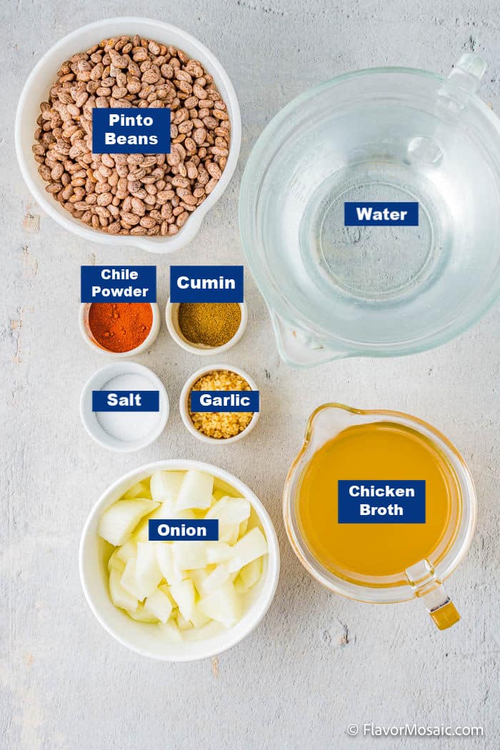 Overhead view of labeled ingredients in individual bowls for Instant Pot Refried Beans