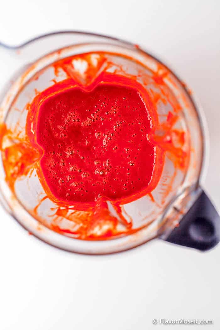 Overhead view of homemade chicken wing sauce in a blender after having been blended.