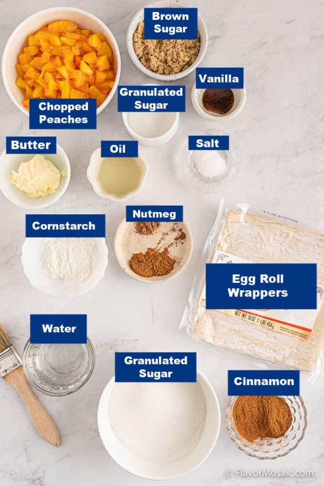 Overhead view of labeled ingredients in individual bowls on a white marble background.