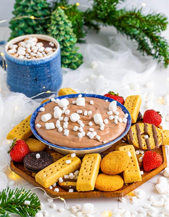 Platter of cookies and strawberries surrounding a bowl of Hot Chocolate Dip topped with mini marshmallows.