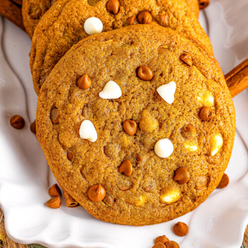 Soft and chewy round gingerbread cookies with white chocolate and cinnamon baking chips.
